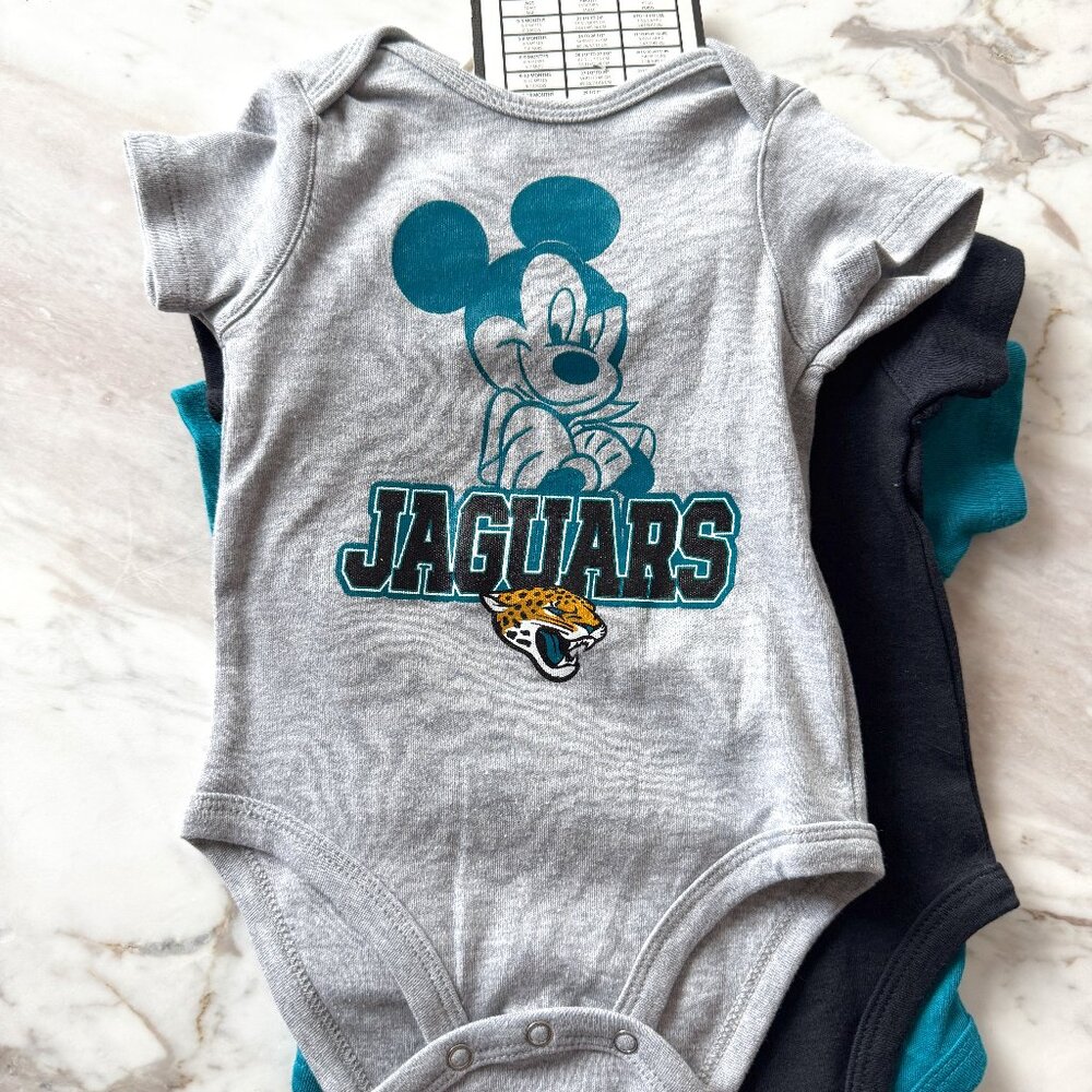 Set of four NWT official NFL Disney Jaguars Months Onesies